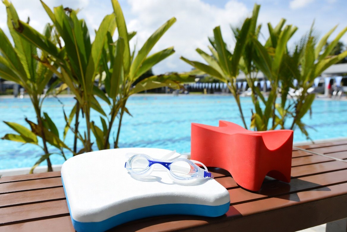 Swim goggles, kickboards and pool accessories at a Singapore public swimming complex.